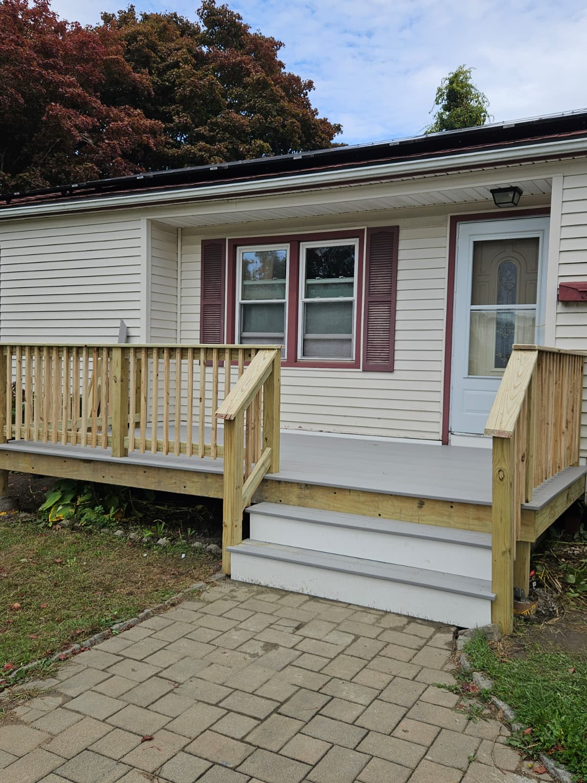 Newly completed front porch deck rebuild by Mission Repair on a home in Portsmouth, Rhode Island